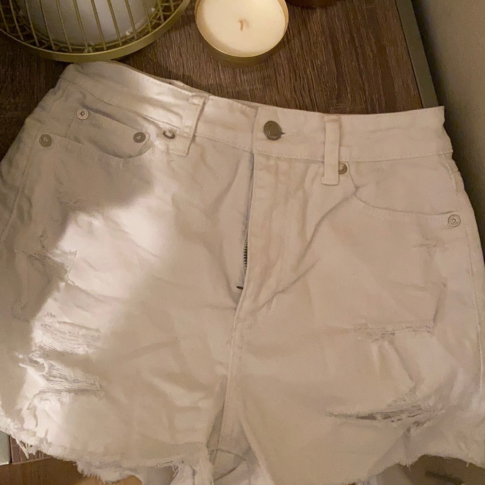 White distressed jean shorts